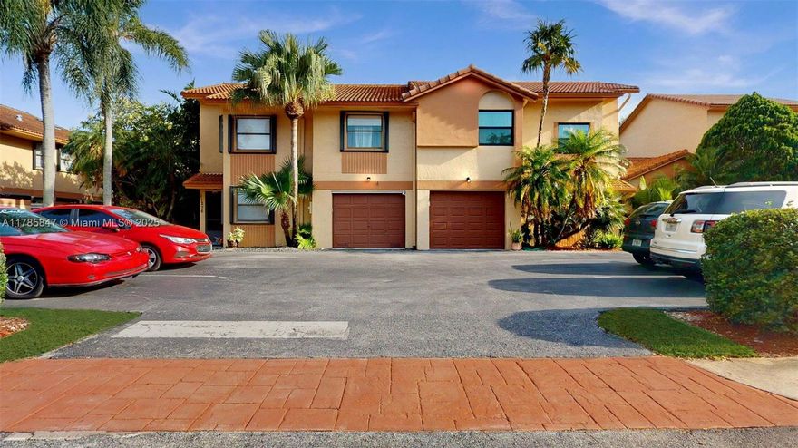 Imagine living in the largest Townhome with a Garage within a Gated Community brimming with amenities right outside your Back Door! This Beautifully Upgraded, Move-In-Ready home offers a seamless flow between the spacious living and dining areas. A Versatile Downstairs Den presents the option for a Fourth Bedroom, complemented by a convenient Laundry Room and a Large Wraparound Patio with Privacy Walls perfect for outdoor enjoyment. Benefit from significant upgrades like IMPACT WINDOWS & DOORS and a NEW AC. With a Low Monthly Fee, indulge in the Community's Clubhouse, Exercise Room, Indoor Racquetball and Basketball Courts, a Sparkling Pool, and a Children's Play Area. The Expanded Kitchen, complete with a Wine Cooler, is an added bonus for Entertaining.