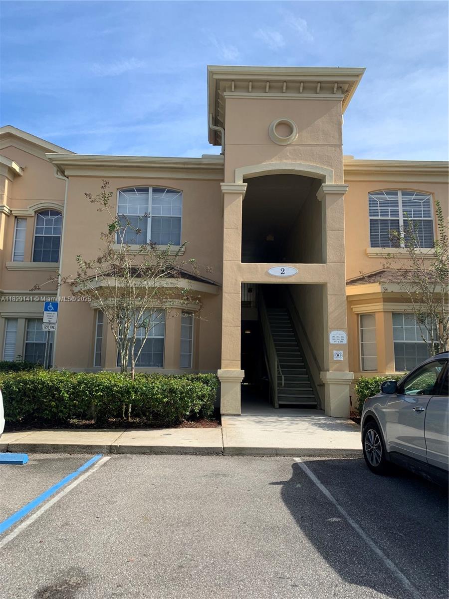 This UPGRADED AND FURNISH Condo at Terrace Ridge At Town Center, a GATED COMMUNITY. THE HOA FEE INCLUDED CABLE, INTERNET, VALET TRASH SEVICE, WATER, PEST CONTROL building insurance and grounds maintenance. NEW ROOF 2024 Close to shopping, Walt Disney World, Reunion, Champions Gate, and easy access to major freeways makes this a desired area to live and enjoy the Central Florida Lifestyle. The OPEN-CONCEPT Living area is inviting and bright with many windows , HIGH CEILINGS, built-in desk ,title floor and carpet . The Kitchen has a Breakfast Bar, upgraded cabinets and CUSTON LIGHTING. Relax on your SCREAM BALCONY over looking the nature and mature trees. This SPLIT FLOOR PLAN unit has spacious bedrooms and dual sinks in the guest ,NOT LOSS THIS OPORTUNITY PERFECT FOR ARBNB AND FIRST HOME