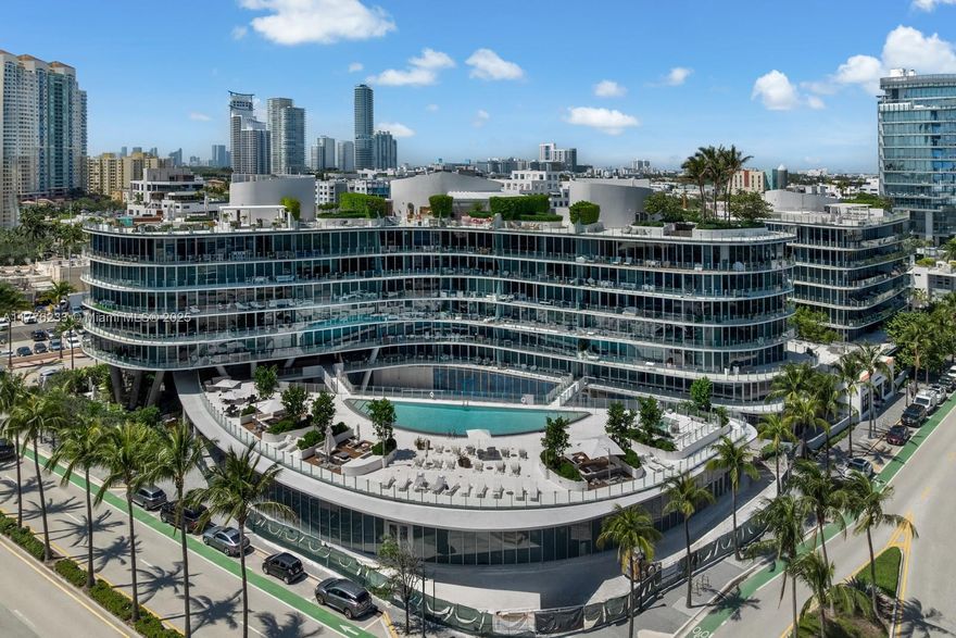 Discover the pinnacle of luxury at 1 Collins Ave #401 in Ocean One. This 3,347sqft boutique residence in the coveted South of Fifth offers refined living with a stately private foyer leading to expansive living spaces. The interiors are thoughtfully designed, offering 5beds/5baths & an additional powder room. Enjoy an exquisite wraparound terrace with panoramic views. The gourmet natural gas kitchen is designed for culinary excellence, while resort-style amenities include a luxury spa, impeccable concierge, and exclusive beach service. Car enthusiasts will delight in 6 dedicated parking spaces—4 in a climate-controlled private garage. Steps from world-class dining at Carbone, Joe’s Stone Crab, Milos, and more, this residence offers an unmatched blend of sophistication and convenience.