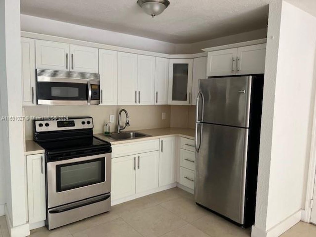Photo of 10701 Cleary Blvd #103, Plantation, FL 33324 (MLS # A11691027)