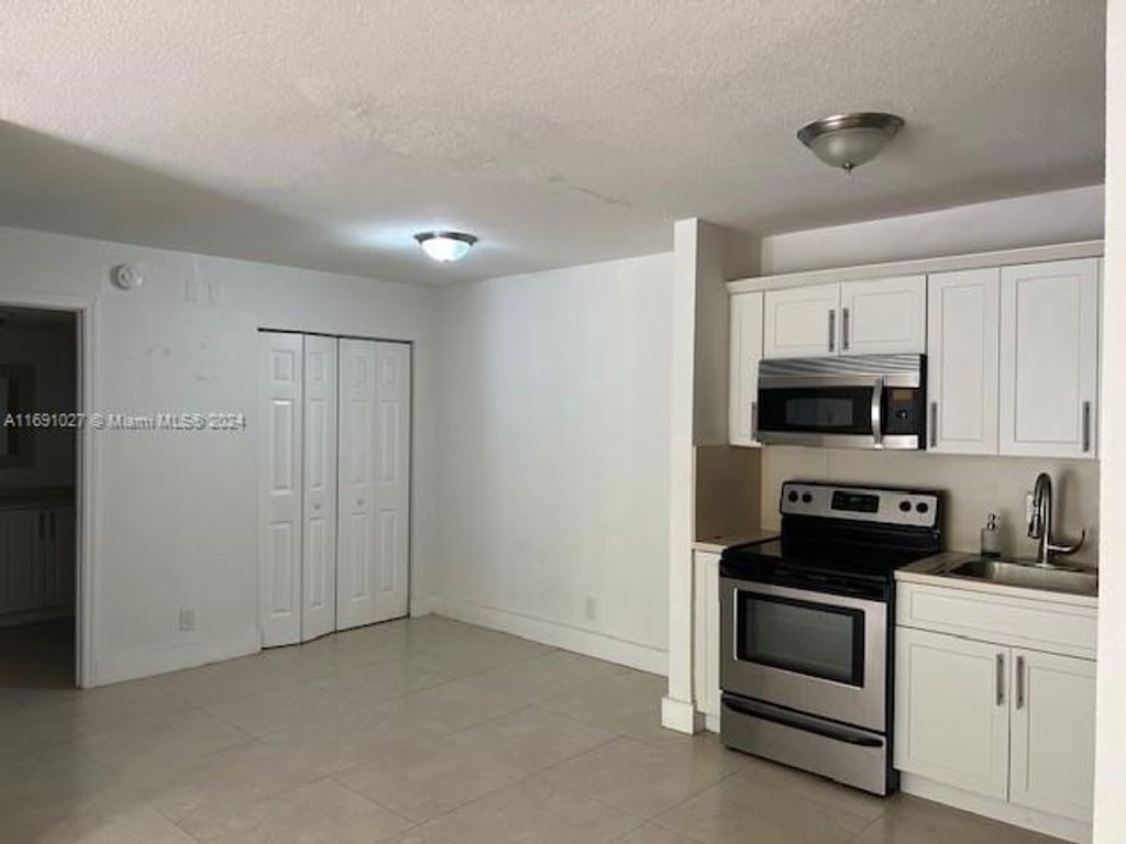 Photo of 10701 Cleary Blvd #103, Plantation, FL 33324 (MLS # A11691027)