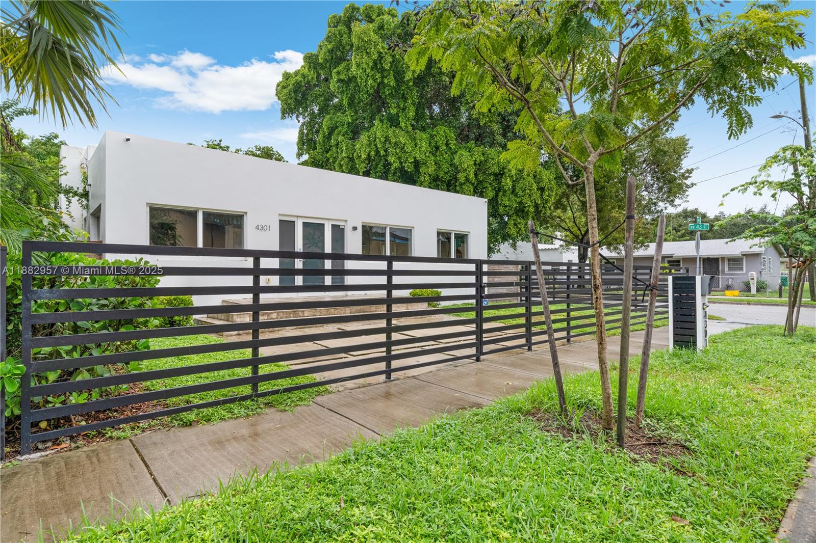 This beautifully updated 3-bedroom, 3-bathroom home with a den offers 2,214 sq. ft. of modern living space. Recent upgrades include a new roof, new flooring throughout, impact windows and doors, and high-end finishes. The kitchen features premium stainless steel appliances and black quartz countertops, while the spacious master suite includes a walk-in closet and glass shower doors. The third bedroom has a separate entrance, ideal for guests or Airbnb income. Enjoy a private backyard and a location just east of I-95, minutes from Wynwood, the Design District, and Midtown. Easy to show and move-in ready!