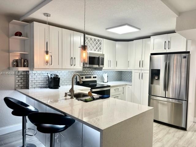 WATER FRONT, UPDATED 2/2 PLUS BONUS ROOM IN THE ALL AGES GATED COMMUNITY OF BOCA BAYOU. BEAUTIFUL, FURNISHED ANNUAL RENTAL, 2ND FLOOR APARTMENT WITH GOURMET KITCHEN, HIGH END STAINLESS STEEL APPLIANCES, QUARTZ COUNTERTOP, NEWER AC, MODERN CUSTOM DESIGNED BATHROOMS AND PORCELAIN WOODLIKE TILE THROUGHOUT. WATER & CABLE WITH HBO INCLUDED IN RENTAL PAYMENT. LESS THAN 10 MIN TO BEACH, MIZNER & BRIGHTLINE. BOCA BAYOU OFFERS A RESORT LIKE EXPERIENCE FEATURING 7 POOLS, 4 GYMS, 2 TENNIS COURTS, BOCCE BALL, SHUFFLEBOARD AND GRILLS FOR THOSE WHO LOVE AN ACTIVE LIFESTYLE. DOCK ACCESS AVAILABLE FOR BOATS UP TO 50 FT. NO PICK UP TRUCKS OR PETS PER ASSOCIATION RULES. ESA/SERVICE ANIMALS OK WITH PROPER DOCUMENTATION. READY TO MOVE IN, JUST BRING YOUR BAGS. HOA CAN RENT ADDITIONAL PARKING SPOTS IF NEEDED.