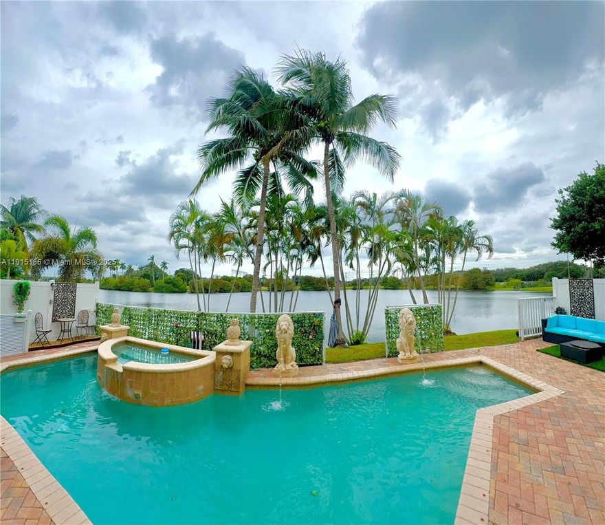 Sought-after Mapleridge community w/ stunning 4B, + in-law suite/3B residence in Fort Lauderdale. Easily convertible loft office upstairs designed by developer for +1 Bedroom. Spanning nearly 3000 sq ft, this home boasts the largest floorplan on the lake w/ breathtaking views, making it a standout gem. Spacious Master w/ serene reading room, offering a personal retreat within the home. A well-appointed in-law suite provides a private exit, ideal for multi-generational living or guest accommodations.  Enjoy outdoor living at its finest w/sparkling pool, hot spa, and a tranquil coy pond, perfectly set against a picturesque lake backdrop. Includes 2-car garage and 3-car driveway, ensuring ample parking. Inside, elegant finishes and spacious rooms create a versatile space.