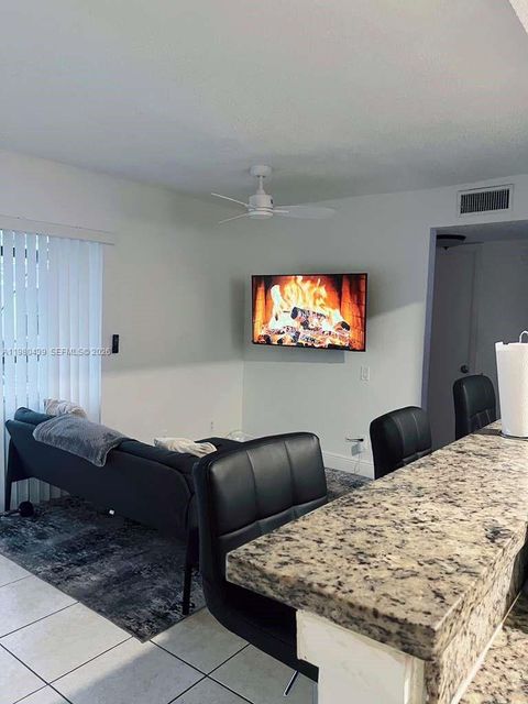 Photo of 4435 Treehouse Ln #H, Tamarac, FL 33319 (MLS # A11980439)