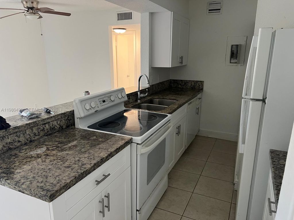 Photo of 4435 Treehouse Ln #H, Tamarac, FL 33319 (MLS # A11980439)