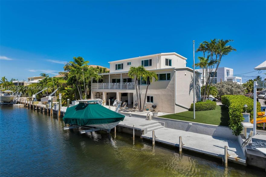 Turnkey Deepwater Boater's Retreat with Private Beach Access in the Heart of Islamorada
Tucked away on a quiet cul-de-sac in one of the most desirable enclaves in Islamorada, this fully renovated 3-bedroom, 3.5-bath home delivers the ultimate Florida Keys lifestyle--where luxury, durability, and world-class boating converge.
Built for peace of mind and longevity, the home features solid concrete construction and a concrete roof, offering superior storm resilience and insurance advantages rarely found in the Keys.
Designed for serious boaters, the property boasts 90 feet of deep-water dockage with immediate access to both the bay and the Atlantic Ocean--no bridges.
Inside, the home is completely turnkey ready. Expansive balconies and a large outdoor patio overlook the wide canal, creating a private waterfront setting perfect for sunset dining.
The oversized paved driveway provides ample parking for guests, trailers, or multiple vehicles -- an uncommon convenience in this area.
What truly sets this property apart is access to a rare, highly coveted private beach area, widely regarded by locals as one of the finest in the Florida Keys, offering a unique blend of boating and beach lifestyle that is seldom available in a single property.
Whether you're seeking a primary residence, a luxury second home, or an income-producing waterfront asset, this property delivers unmatched versatility and strong potential for high-end monthly rentals.