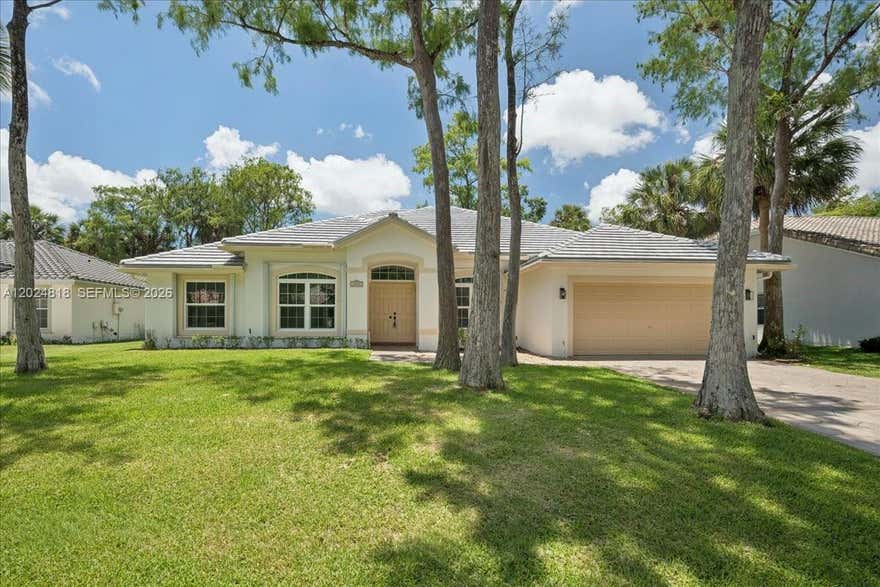 Beautifully Updated 4BR/3BA Home in a Gated West Lauderhill Community! Welcome to this spacious and move-in-ready 4-bedroom, 3-bathroom home featuring soaring high ceilings and an open, airy layout. Recent upgrades include a brand-new roof (2026), impact windows, fresh interior and exterior paint, and new lighting fixtures throughout, offering both style and peace of mind. The home features a generous living space, a 2-car garage, and an ample driveway with plenty of parking. Enjoy relaxing or entertaining in the screened-in back porch overlooking the private backyard. Located in a desirable gated community in West Lauderhill with a low HOA, this home combines comfort, security, and convenience with easy access to shopping, dining, schools, and major highways. Don't miss this opportunity to own a beautifully updated home with modern improvements and exceptional value!