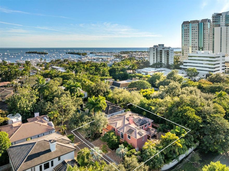 Located in the exclusive, gated community of Treasure Trove in the heart of Coconut Grove, this renovated 5,076 Sq Ft, 5-bedroom, 5.5-bathroom two-story villa offers a spacious and bright layout. Porcelain and hardwood floors, high-impact windows and doors, a gourmet kitchen with high-end stainless steel appliances, a wine cellar, and ensuite bedrooms ensure comfortable and sophisticated living. Sitting among tropical lush landscaping, on a 10,000 Sq Ft lot, the home also features a pool with a waterfall jacuzzi, a tiki, and an ample covered terrace, perfect for entertaining. Solar panels, a 20kw generator, and Tesla battery walls and EV charger are included for energy efficiency. A Grove's true treasure in close proximity to the finest dining, shopping, and schools.