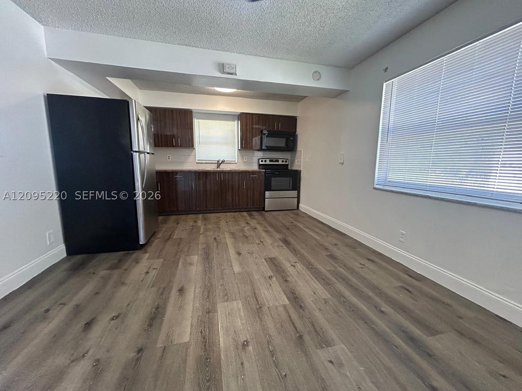 Photo of 4117 Woodside Dr #2, Coral Springs, FL 33065 (MLS # A12095220)
