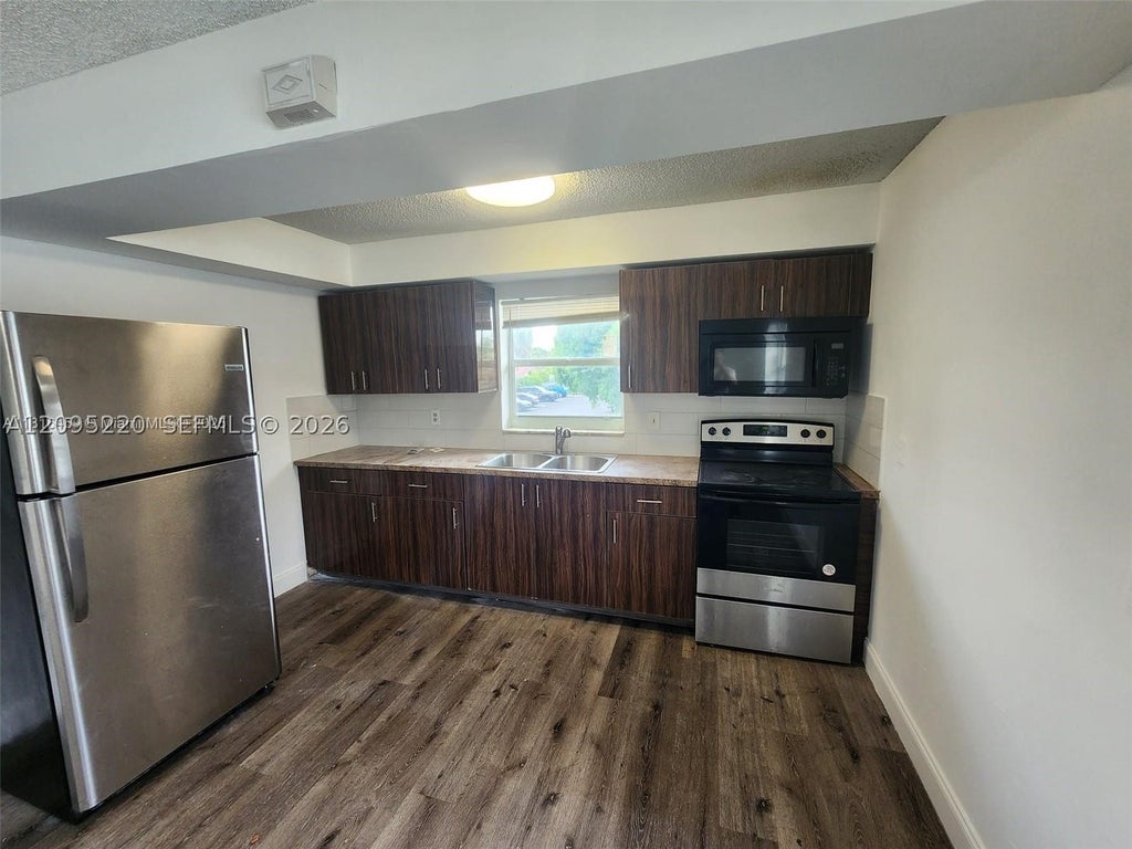 Photo of 4117 Woodside Dr #2, Coral Springs, FL 33065 (MLS # A12095220)