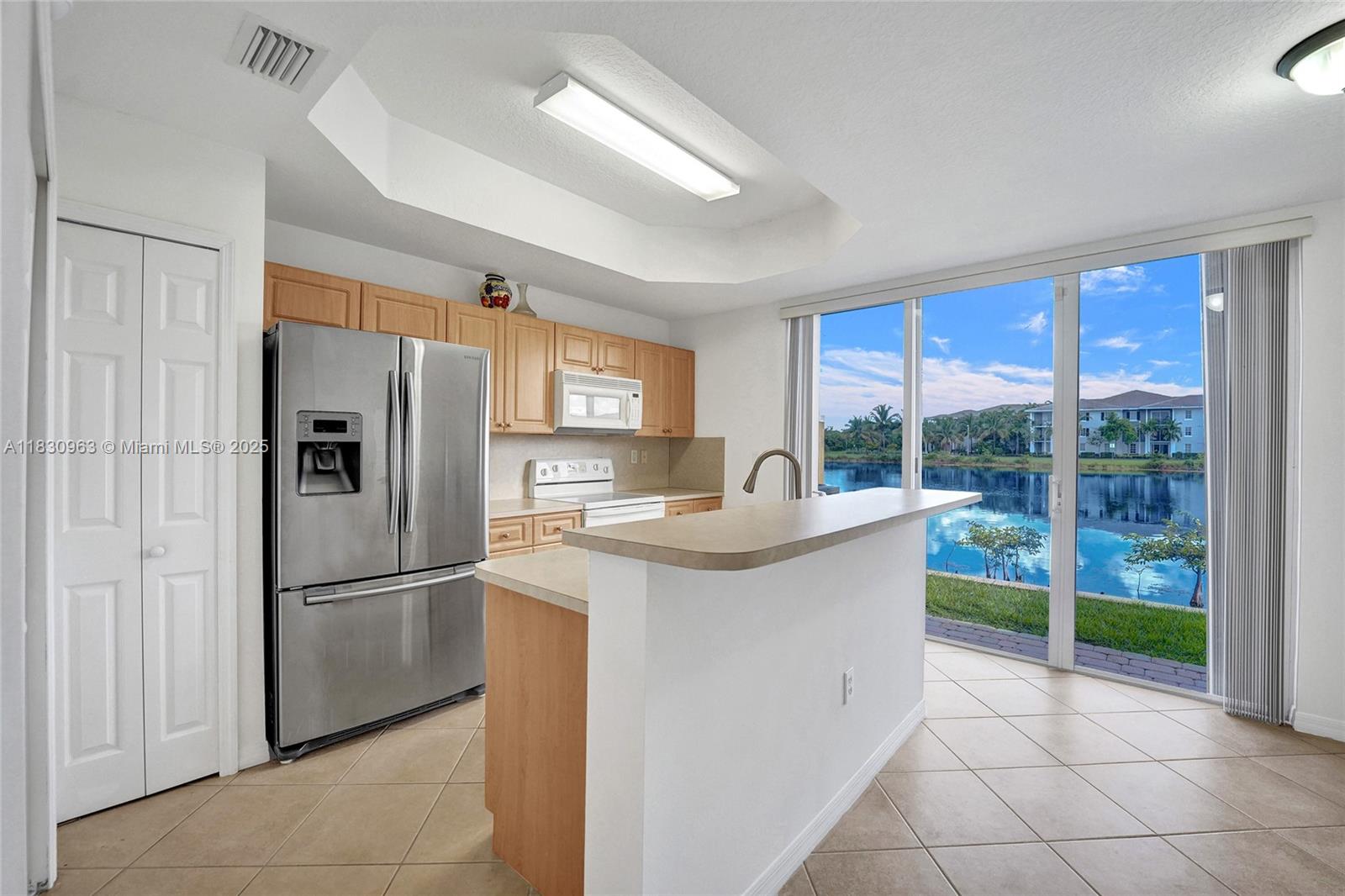 ***BEAUTIFUL LAKE VIEW townhouse! Right when you walk in you can't help but notice the beautiful Lake. This home has lots of space with a family room and large kitchen/dinning area on the first floor. Up stairs you have two master suites with large walk in closets. This house is equipped with new AC, new laminate flooring on the stairs and entire second floor. Accordion shutters throughout for ease and peace of mind. Relax or entertain on the back patio with the view of the sunset . This home is perfect for couples or small families. A must see!!! more Pictures to come .