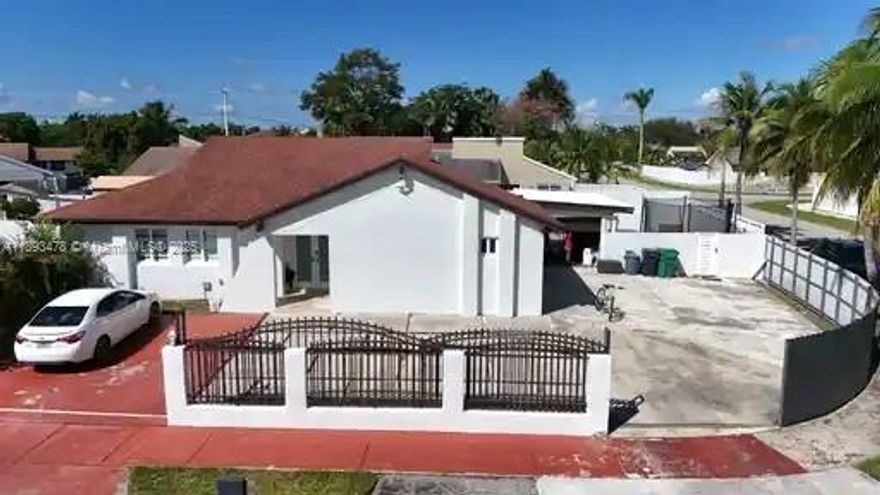 Beautiful 4-Bedroom, 2-Bathroom, and 1-car garage Home on a Quiet CORNER LOT! This single-family home is perfectly situated on a CUL-DE-SAC in a great neighborhood. Enjoy a covered entry and a spacious covered patio with a bar—ideal for outdoor living and entertaining. Features included updated flooring, a modern kitchen with stainless steel appliances, and an in-unit washer and dryer. Additional highlights include a roof installed in 2017, IMPACT WINDOWS AND DOORS, NO HOA, a gated entry, and ample parking space for multiple vehicles. The master bathroom is on the right side of the house and offers potential for a rentable unit with a separate entrance. Conveniently located near major roads, shopping centers, schools, and parks. Easy to show.  Ready to welcome you home!