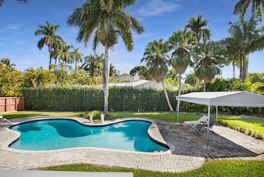 Stunning Contemporary 4 Bedroom 2 Bath Home in Hollywood Lakes.
Located in the heart of Hollywood Lakes, this gorgeous home sits on a rare double lot, offering exceptional space and privacy. Featuring a bright and airy contemporary design with soaring volume ceilings, the home boasts a spacious living area and a sleek, updated kitchen with stainless steel appliances. The luxurious master suite overlooks the custom-designed pool and lush landscaping, with French doors leading to a private deck and spa-like en-suite bath. Enjoy seamless indoor-outdoor living in this beautifully updated retreat, perfect for relaxation and entertaining.