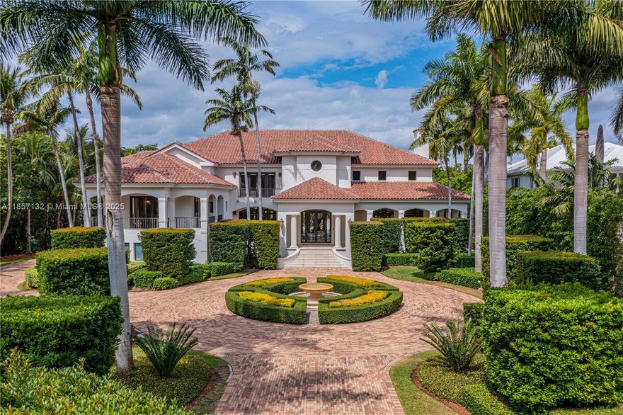 A one-of-a-kind, Mediterranean estate in the prestigious and private gated community of Tahiti Beach Island. Located at the end of a cul-de-sac, sitting on over an acre and featuring 25-foot-high ceilings in the foyer & living room. Perfect for entertaining, the large kitchen with wet bar and butler’s pantry leads to a light filled family room that opens to an extensive outdoor terrace, 24 x 40 pool and guest house. Boasting an opulent primary bedroom with dual closets, an oversized bathroom and a private balcony looking over the pool and yard. Tahiti Beach Island offers a private beach, tennis courts, pickleball & access to all of Cocoplum’s amenities.