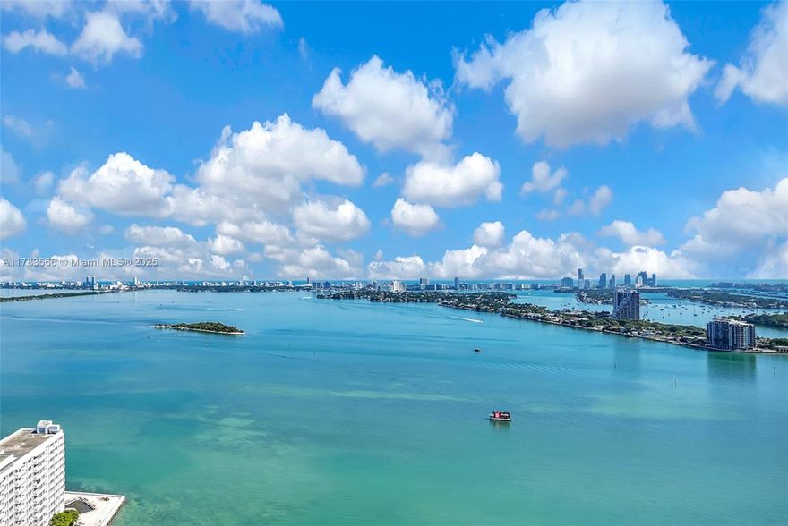 Welcome to this stunning 2-bed, 2-bath at Paramount Bay, the highest available 08 line with unbeatable panoramic views of Biscayne Bay, the ocean, downtown, and Venetian Islands. Modern interior with custom feature wall, sleek glass accents, and chic backsplash in a contemporary kitchen with SubZero & Wolf appliances. Spacious split floor plan, 10-ft ceilings, and a deep balcony with floor-to-ceiling sliding doors, perfect for indoor-outdoor living & entertaining. Primary suite offers a walk-in closet, spa-like bath with glass shower & double vanities. Resort-style amenities include white glove valet & concierge, 2 pools with towel service, jacuzzi, gym with daily fitness classes, spa, sauna, kids' room, plus on-site nail, beauty, massage, and spa services. HOA includes internet & cable.