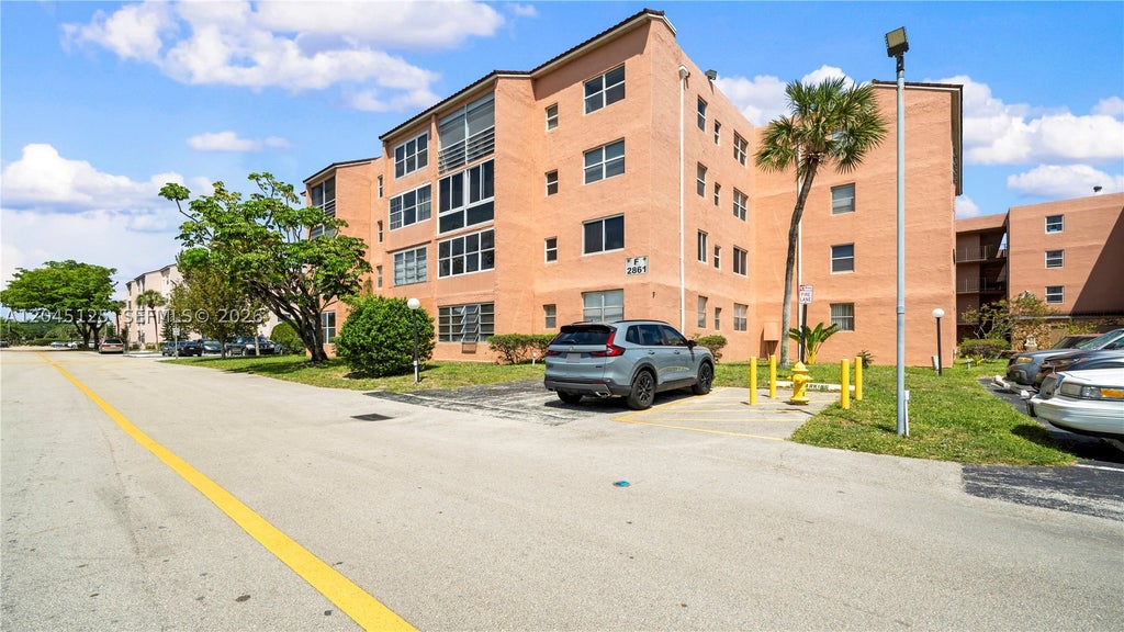 Photo of 2861 Somerset Dr #301, Lauderdale Lakes, FL 33311 (MLS # A12045125)