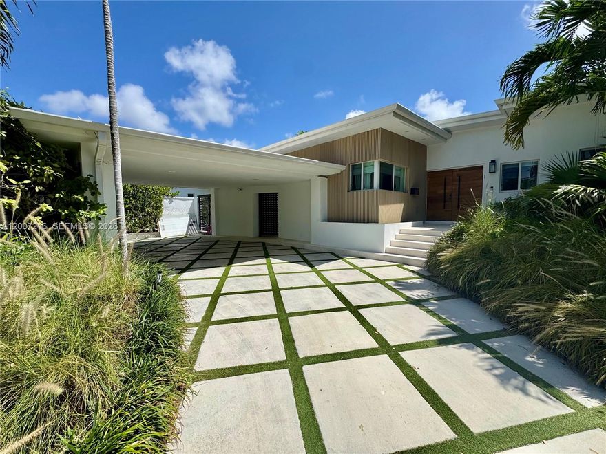 Fully renovated waterfront residence in the gated community of Belle Meade, set on one of the highest elevation lots in the neighborhood. Positioned above current flood requirements and eligible for a favorable flood certificate, offering a rare advantage for waterfront ownership in Miami.

Completed in 2020, this fully permitted renovation included nearly 1,000 SF of additional living space along with all new electrical, plumbing, and structural upgrades. The home features a new roof, dual HVAC systems, tankless water heaters, buried FPL power lines, and hurricane impact windows and doors throughout.

The interior showcases a custom Italkraft kitchen with Sub-Zero and Wolf appliances including convection oven, steam oven, warming drawer, and wine storage. Natural stone finishes, a custom wood bar, and spa-style bathrooms with Hansgrohe fixtures elevate the design. Smart home features include Lutron lighting, Cat 5 wiring, and a multi-zone Sonos sound system inside and out.

Outdoor living is equally impressive with a saltwater pool, electric heater, outdoor kitchen, and professionally landscaped grounds. The new composite dock includes a 27,000 lb boat lift & 76 feet of water frontage, power, water, and lighting, ideal for boaters.

Turnkey, high-elevation waterfront living in one of Miami’s most sought-after gated enclaves.