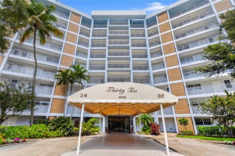 Photo of 3010 N Course Dr #510, Pompano Beach, FL 33069 (MLS # A12043672)