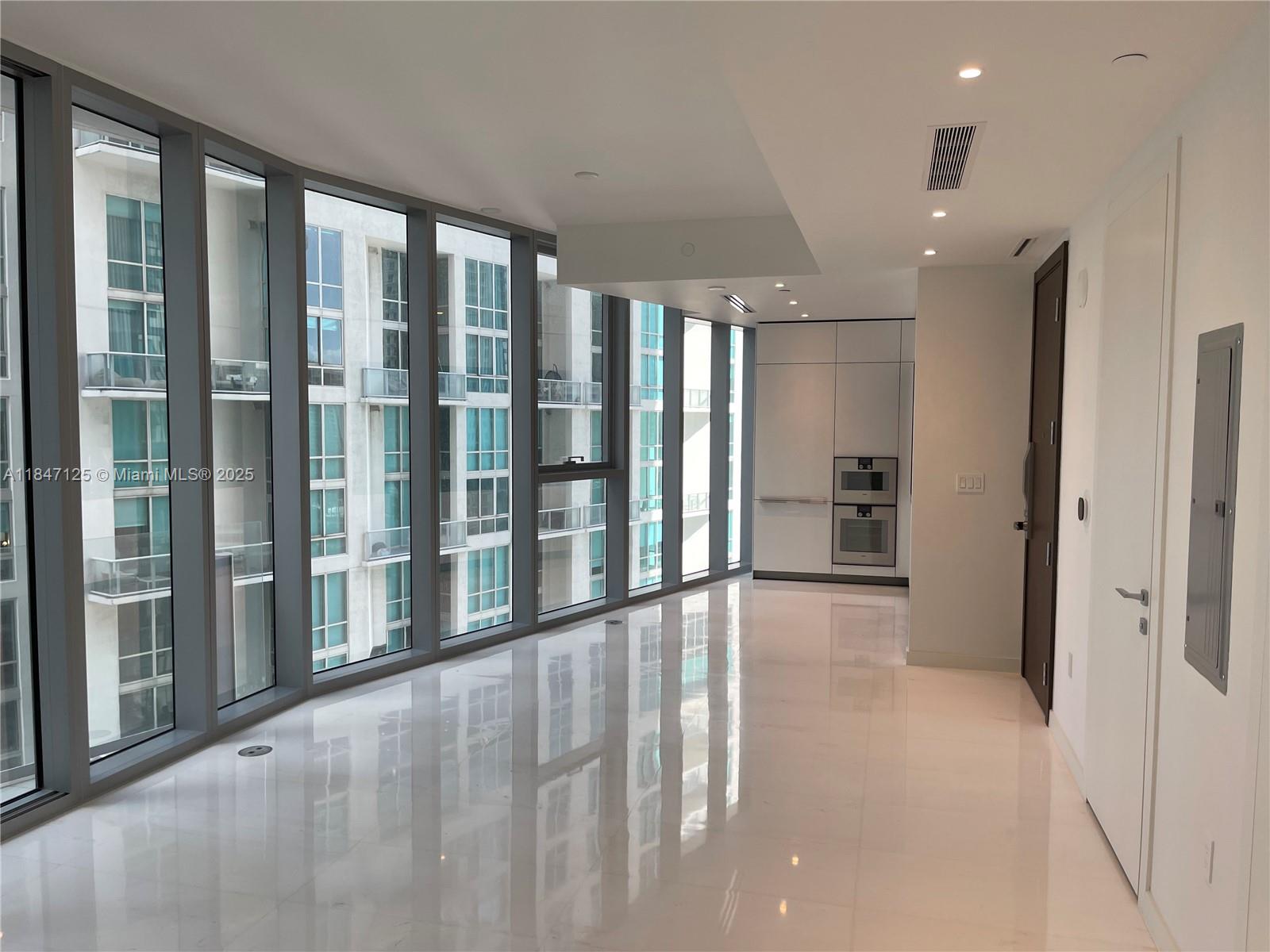Spectacular Unit in One of Miami's Newest Luxury Building, open concept with state of the art amenities that Include two levels fitness center, Infinity Pool with Cabanas and Panoramic Views, Indoor Pool, Men & Women Spa with Sauna and Steam Room, Boxing Room, Yoga, Spinning, Virtual Golf Simulators, Private Movie Theater, Ski Bar Lounge, Chef's Kitchen, Private Dining Areas, Private Marina, Concierge Services, Business Center, Kids playroom. This unit comes with top of the line Gaggenau Appliances, Bulthaup Kitchen, Custom Closet, Motorized Window Treatments, White Marble Floors, Surrounded by great restaurants and nightlife.