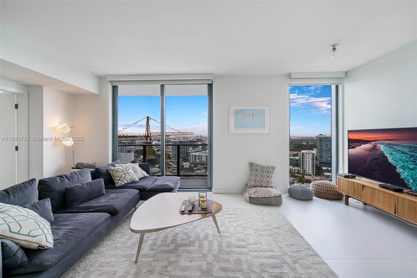 AVAILABLE NOW! Fully furnished 2BED/2BATH residence at Paraiso Bayviews, ideally located in Edgewater, just minutes from the Design District, Wynwood, and Midtown Miami's vibrant entertainment hub known for its shopping, dining, nightlife, and arts scene. This beautifully decorated unit features 9-foot high ceilings with floor-to-ceiling windows, primary bedroom with queen-size bed, second bedroom equipped with two full-size beds. Fully equipped for a comfortable stay. Paraiso Bayviews boasts resort-style amenities, including Rooftop pool with bay views, Sunset pool, Tennis & paddle courts, BBQ areas, Children's playroom & billiards room, State-of-the-art fitness center & spa, theater, Valet parking & concierge service. Rate is for annual lease.