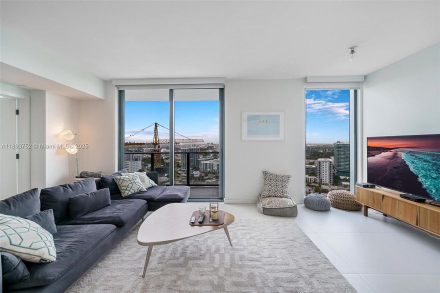 AVAILABLE NOW! Fully furnished 2BED/2BATH residence at Paraiso Bayviews, ideally located in Edgewater, just minutes from the Design District, Wynwood, and Midtown Miami's vibrant entertainment hub known for its shopping, dining, nightlife, and arts scene. This beautifully decorated unit features 9-foot high ceilings with floor-to-ceiling windows, primary bedroom with queen-size bed, second bedroom equipped with two full-size beds. Fully equipped for a comfortable stay. Paraiso Bayviews boasts resort-style amenities, including Rooftop pool with bay views, Sunset pool, Tennis & paddle courts, BBQ areas, Children's playroom & billiards room, State-of-the-art fitness center & spa, theater, Valet parking & concierge service. Rate is for annual lease.