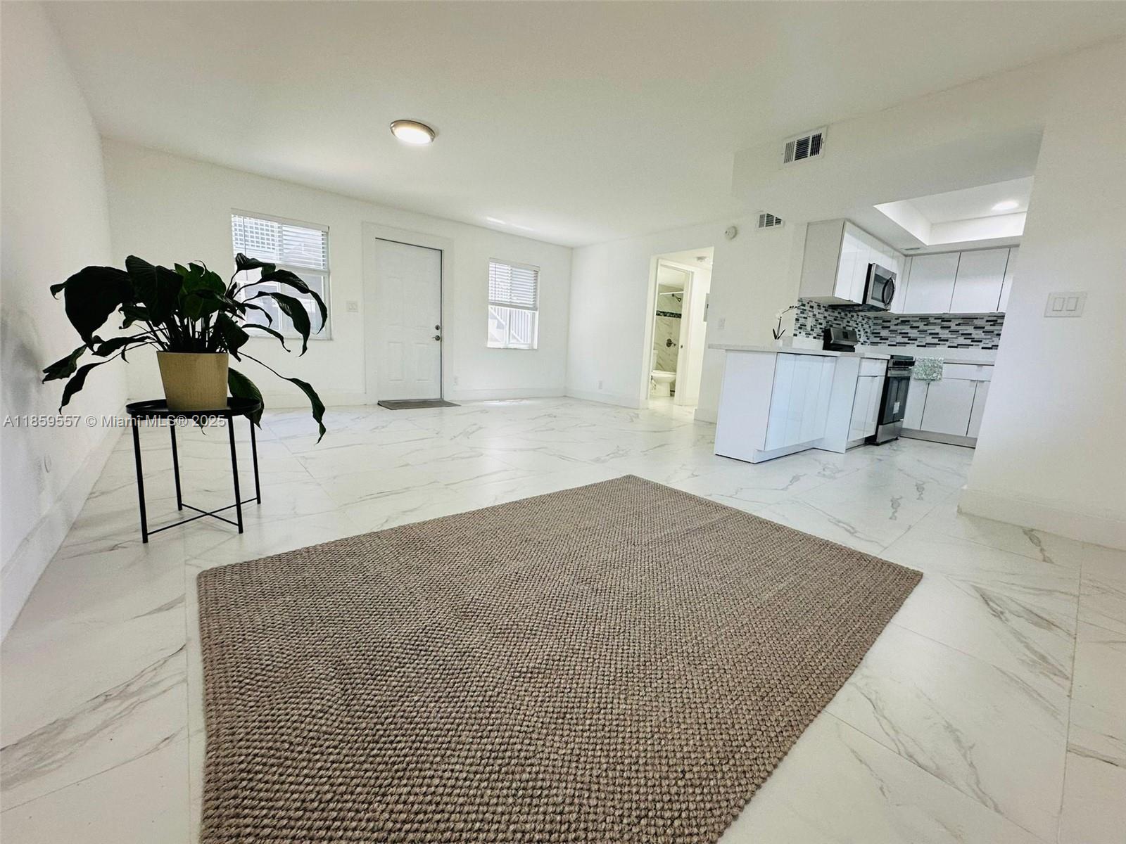 Stylish apartment with abundant natural light, nestled in one of Fort Lauderdale's most coveted neighborhoods. Enjoy serenity amidst lush greenery, just steps away from major thoroughfares: a mere 50 meters from A1, 8 minutes from I-595, and downtown Las Olas, with the beach a mere 10 minutes away. This exceptional unit is part of an enclave of only 8 residences, where internal guidelines foster a harmonious and tranquil living environment for all residents. Brand new appliances. Community amenities include a fully-equipped laundry facility with washer and dryer.