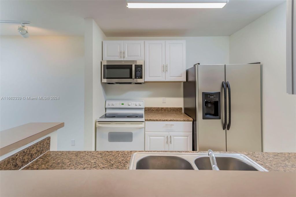 Photo of 4015 W Mcnab Rd #D207, Pompano Beach, FL 33069 (MLS # A11662339)