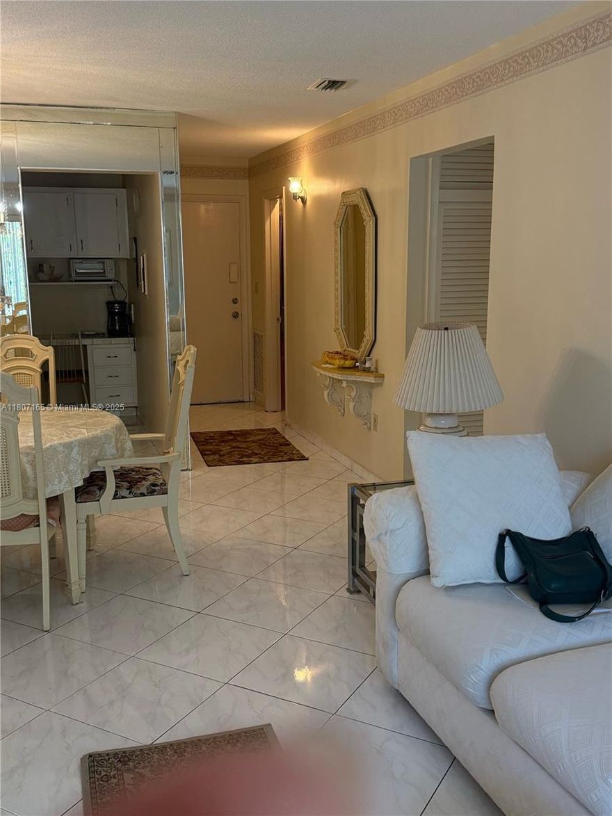 JUST REDUCED.  COME SEE THIS BEAUTIFUL CONDO IN NORTH MIAMI BEACH.   2/2 IN EXCELENT CONDITION AND READY TO MOVE IN.  WITH CERAMIC FLOOR THROUGHOUT. QUIET GATED NIGHBORHOOD IN, PATIO AND AMENITIES.  2 HEATED SWIMMING POOLS, BBQ/PICNIC AREA, CLUBHOUSE-CLUBROOM, COMMON LAUNDRY, FITNESS CENTER, LIBRARY, SAUNA, SHUFFLEBOARD.  MINUTES FROM SHOOPING CENTER, RESTAURANT AND THE BEACHES.