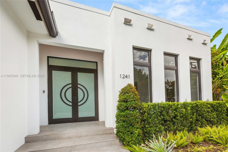 Stately luxury meets modern design in this brand new built Coral Gables residence. Featuring 4 bedrooms, 5 baths, and 3,400 sf. of open living space with soaring 21-ft ceilings. The chef’s kitchen with Thermador appliances is ideal for entertaining or quiet evenings at home. Flooded with natural light, the home offers serene views of the pool and lush, professionally landscaped grounds. The primary suite includes a soaking tub and bidet. Enjoy top-tier impact windows, a two-car garage, circular drive, security cameras, and custom finishes throughout. Nestled on a gated 12,000 sf. lot shaded by oak trees, just minutes from Merrick Park, downtown Coral Gables, UM, and South Miami. A true gem!