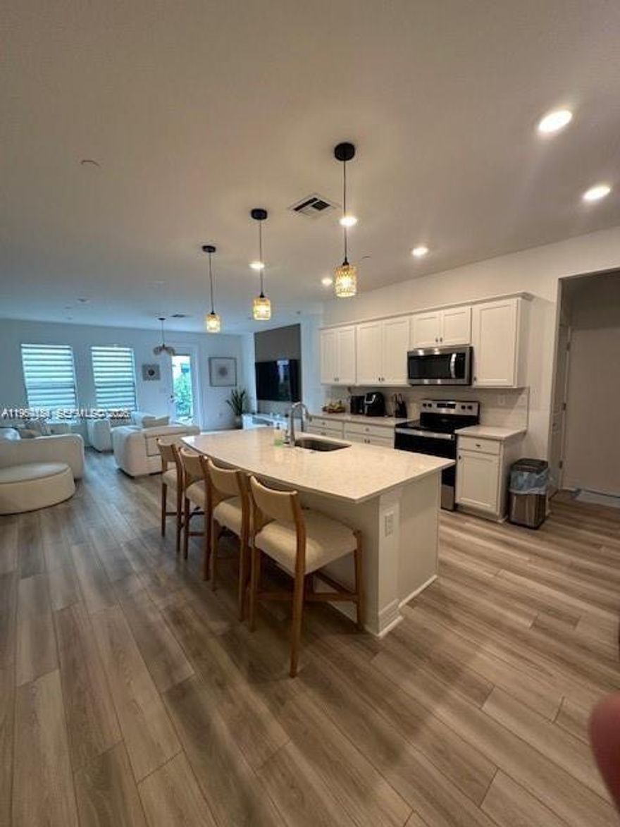 Beautiful new construction 3/2.5 townhouse featuring an open layout, upgraded kitchen and baths, modern finishes, floors, impact windows, and in-unit washer/dryer. Includes multiple upgrades and add-ons throughout. Convenient location near shopping, dining, and major roads. Has a charging station for electric vehicles.