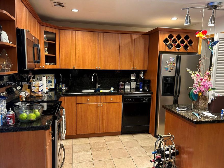 Impact Windows, Low HOA, Private backyard, Commercial vehicles are allowed.
 Locate Near shopping Center, FIU, and major roadways.