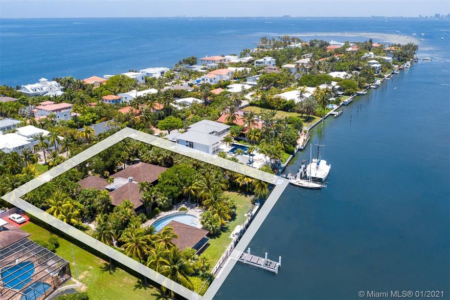 Yachtsmans Paradise! Unique and rare opportunity to own one of the few remaining and most sought after double plus lots on private and wide bodied Hurricane Harbor. This oversized 31,996 sqft lot includes 152 linear ft seawall and a long dock jetting into the harbor. Ideal for multiple boat dockage and/or yacht. Unique custom built and "over built" Polynesian style 4/3.5 pool home plus separate guest house. Home features Guyana Greenheart wood, teak, copper and coral rock. Ideal residence for entertaining with expansive coral rock patios and large pool with waterfall.