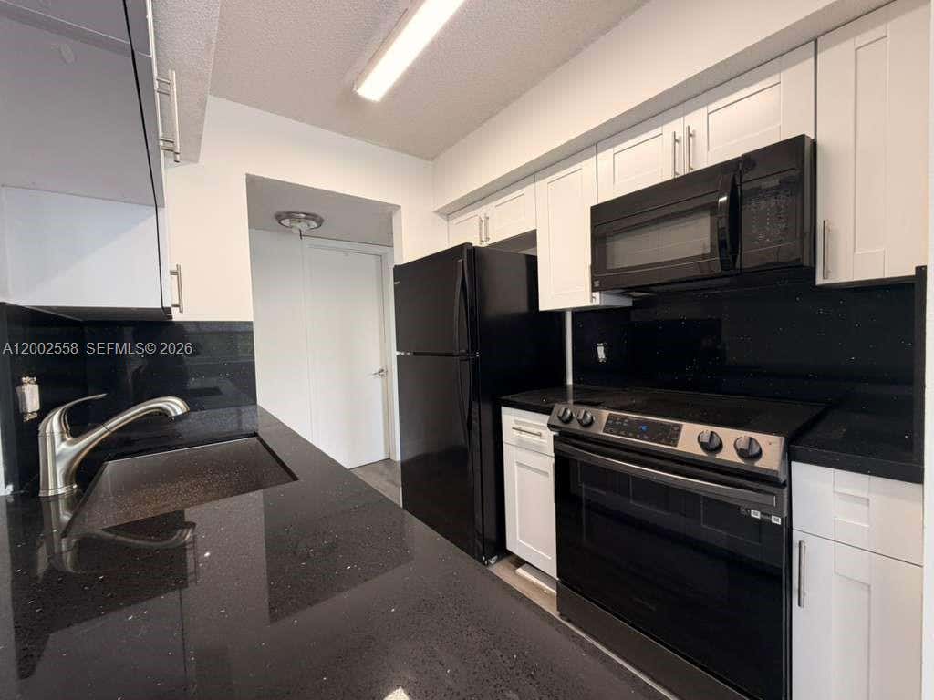 Photo of 5760 Rock Island Rd #330, Tamarac, FL 33319 (MLS # A12002558)