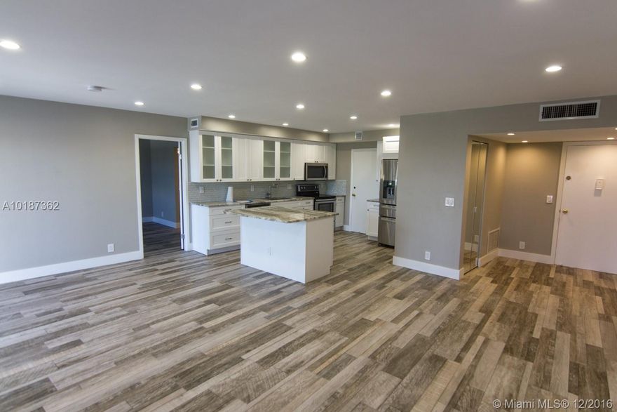 THE BEST UNIT IN THE COMPLEX, COMPLETELY REMODELED FROM A TO Z WITH NEW PORCELAIN TILE FLOOR, NEW KITCHEN WITH GRANITE COUNTERTOP, NEW STAINLESS STEEEL APPLIANCES, NEW CUSTOM DESIGNED MARBLE BATHROOMS WITH DUAL SINK IN MASTER BATHROOM, NEW VANITIES, NEW IMPACT WINDOWS AND SLIDING DOOR, NEW LED LIGHTS, NEW DOORS COVERED PARKING SPACE CLOSE TO THE ENTRANCE AND MORE. ENJOY THE WATER VIEW FROM THE BALCONY OR THE NICE POOL BY THE WATER. GREAT LOCATION, ACROSS FROM THE GOLF COURSE,MINUTES TO THE BEACH,SHOPPING.