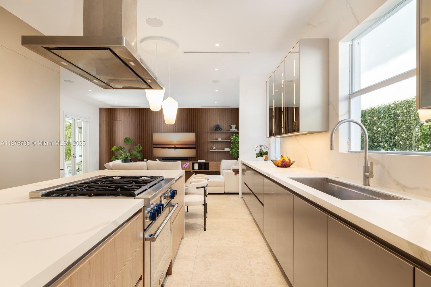 Impeccably renovated 2008 Mediterranean residence in North Coconut Grove with 5,234 SF total, and 4,455 SF of living. Elegant interiors feature double-height ceilings, a gourmet kitchen with custom Italian cabinetry and Sub-Zero, Thermador, and Miele appliances. The spacious primary suite offers dual Italian finished walk-in closets, a spa bath, and a balcony. Renovations include Italian paneling, updated baths/closets, Lutron lighting, sound system, Lennox ACs, water softener, Tesla EV charger, solar panels with backup battery, and a fully redone heated pool/deck. Impact windows/doors, gated entry, control four system, and 2-car garage. Entry via Crystal Ct. Minutes to Grove Village, parks, marinas, schools, MIA & beaches.