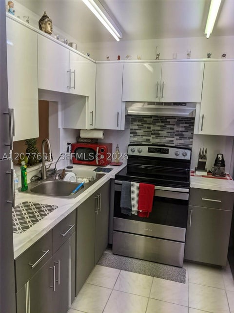 Photo of 233 NE 14th Ave #205, Hallandale Beach, FL 33009 (MLS # A12077631)