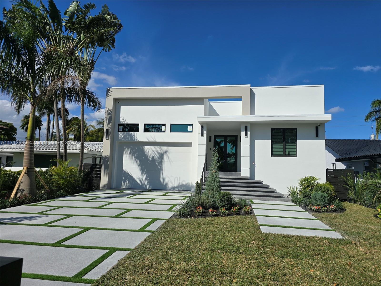 Discover unparalleled luxury and sophistication in this brand-new, turn-key residence located on the prestigious Washington Street, just moments from the lakes, ocean, and a host of sought-after amenities. This 2,067 sq. ft. under AC home offers an elevated living experience with every modern convenience, all within close proximity to Hollywood’s best attractions. Open Concept Design with a great layout connects the living room, dining area, and an Italian design kitchen, creating a fluid and welcoming environment. High end appliances. Built-in media center and built-in ceiling speakers. Surveillance cameras. fully finished walk-in closet. Garage with high ceilings, plus a driveway that accommodates up to 5 additional vehicles.