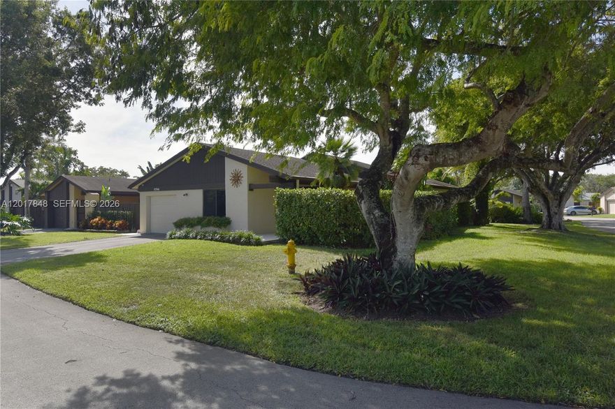 The prettiest, corner house in The Crossings! Beautiful white porcelain floors, nicely updated bathrooms, lots of closet space, his and her closets in master bedroom, ample kitchen with lots of cabinet storage, stainless steel appliances, granite counters, extra ceiling insulation, pod lights, extra large family room, all impact windows and doors, new plantation shutters, woven wood shade in living room window, solar roller shades and panels, burglar and fire alarms, front and back security cameras, new front wood siding, epoxy floor and utility sink in clean garage, tankless water heater, huge back patio with sprinkler system and plenty of room for a pool and gazebo. This house is turn-key and ready for the pickiest buyer! Low HOA fee with great management. Magnificent clubhouse and recreation areas. Great schools, stores and restaurants very close by. Easy access to turnpike. Easy to show. Dining room chandelier not included.