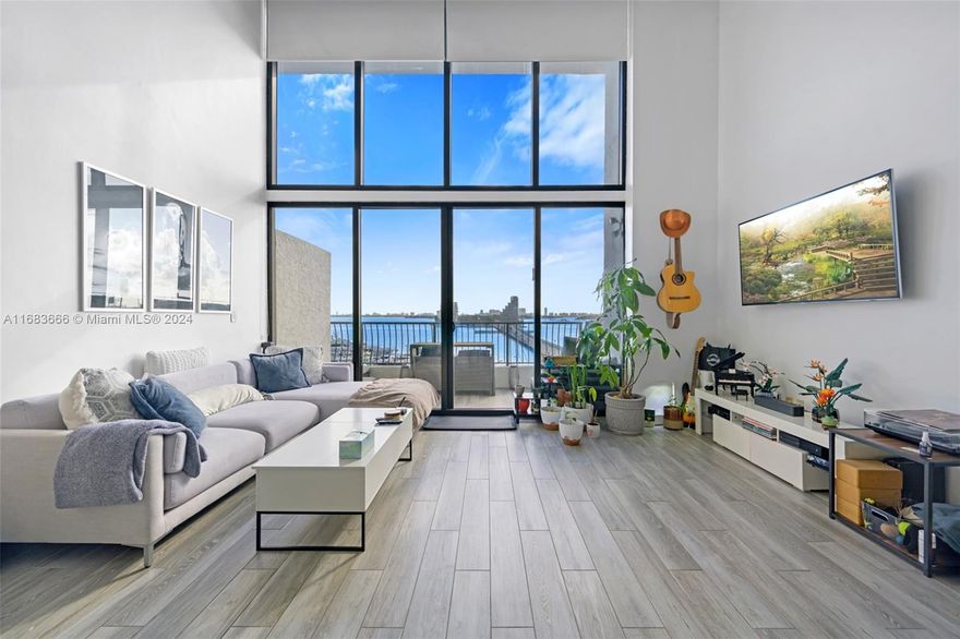 Discover the pinnacle of luxury living in this stunning 2-story loft, offering breathtaking views of South Beach, Venetia Marina, and the Bay. With an open, spacious floor plan and soaring double windows, natural light fills the home, flowing out to a lighted terrace for an unforgettable backdrop day or night. This unique 1-bedroom, 1.5-bath gem is unlike anything else in the building, including one Valet (possibly two) parking spaces for convenience. Situated on the Venetian Causeway, you’re just 3 minutes from South Beach, Downtown Miami, the Design District, and Wynwood. A rare opportunity—don’t miss out!