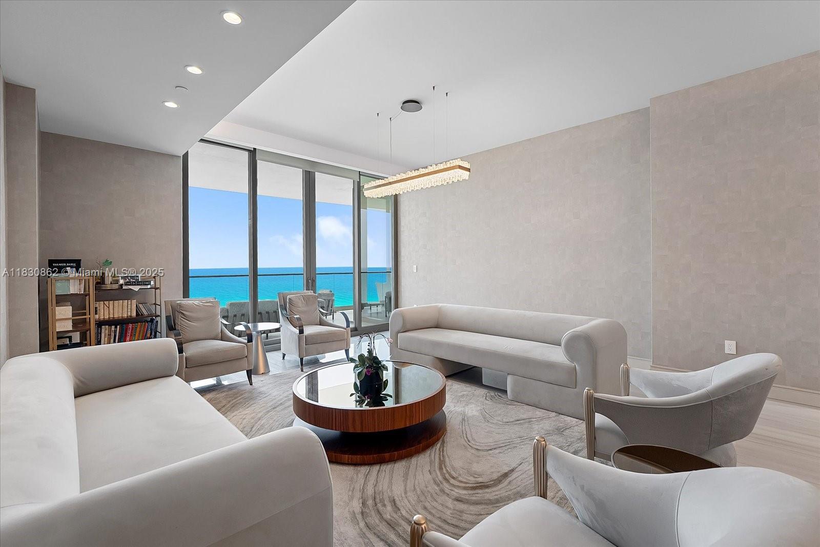 Step into a world of refined sophistication in this stunning Vecchio residence, located in the prestigious Estates at Acqualina. This oceanfront home offers a seamless blend of timeless design and modern luxury. With panoramic views of the Atlantic and Intracoastal, the residence features expansive terraces, a summer kitchen, and a thoughtfully designed flow-through layout. Inside, marble floors lead you through a grand living space with custom cabinetry, a La Cornue gas range, and a gold onyx spa-inspired bath with a steam shower. A den provides flexibility for a home office or media retreat, while smart-home automation ensures effortless living. The Estates at Acqualina delivers an extraordinary lifestyle with five-star amenities, including fine dining, and a private beach club.