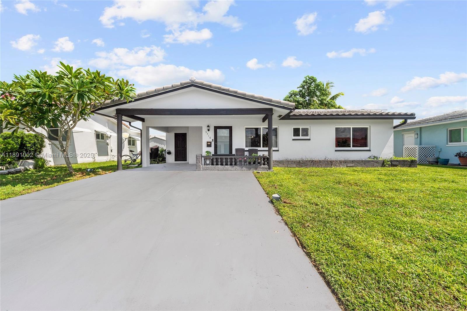A serene retreat in the desirable 55+ Mainlands community has come to market. Features include hardwood floors throughout, open living and dining areas, stainless steel kitchen appliances. Enjoy peace of mind knowing you're protected with impact windows & front door (2022), a new roof (2022), and new AC system (2024). The relaxing front porch and scenic backyard offer ideal spaces to unwind or entertain. The versatile Florida room has its own entrance and is turn key to serve as a studio, office, or guest suite. A tiled area beside the carport is perfect for barbecues. Experience comfortable, low-maintenance living at its best!