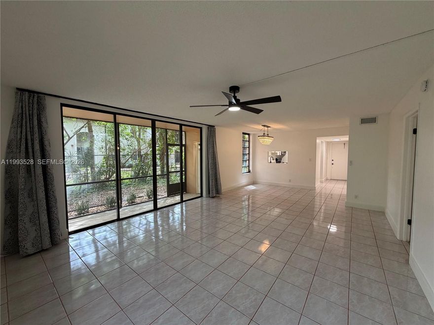 Don’t miss this rare opportunity to lease a spacious and well-positioned 2 bedroom, 2 bathroom corner unit in the highly desirable Lago West community in Plantation. Situated on the first floor, this residence offers an expansive 1,130 square foot layout with a bright open living and dining area, split bedroom floor plan, and a large screened-in patio overlooking peaceful canal and garden views. The corner positioning provides added privacy and an abundance of natural light throughout. Recently updated for comfort and modern living, the unit features tile flooring throughout, an updated kitchen with ample cabinetry, and newly renovated bathrooms. The layout flows seamlessly, making it ideal for both everyday living and entertaining. Both bedrooms are generously sized with walk-in closets and easy access to full bathrooms. Enjoy the convenience of covered parking located directly in front of the unit, along with ample guest parking. Lago West is a well-maintained community offering resort-style amenities including a pool, clubhouse, fitness center, tennis courts, and beautifully maintained grounds. Ideally located just minutes from I-595 and I-75, Sawgrass Mills Mall, top-rated schools, dining, shopping, and Fort Lauderdale-Hollywood Airport, this property offers both convenience and accessibility in one of Plantation’s most central locations. A rare opportunity to lease a well-maintained and spacious unit in a highly desirable community. Schedule your showing today.