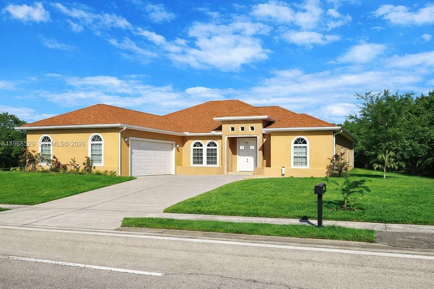 4 Bedroom 3 Bath Custom Built Home.  Just Newly built in 2021. Modern Elegance and wide open floor plan with 10-foothigh ceilings in every room, accentuated by tray ceilings in the living room, kitchen, dining area, and 2 large master bedroom En-Suites with His and Hers walk in showers and separate bathing tub. Designed with a split bedroom layout on opposite sides of the home for privacy and additional 2 more guest bedrooms as well—each detail meticulously designed to elevate quality of living in this architecturally well designed home. Screened in Florida room, Laundry room. Hurricane Impact windows and doors!  Turn Around Area in Driveway for easy exit to street. No HOA!