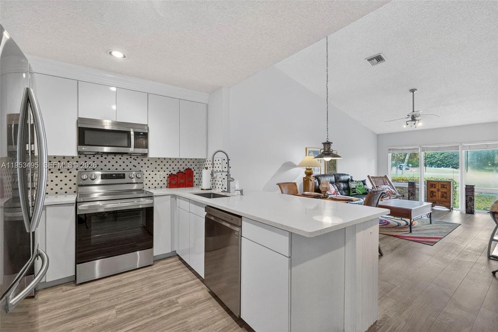 Photo of 6744 N Pine Island Rd, Tamarac, FL 33321 (MLS # A11953495)