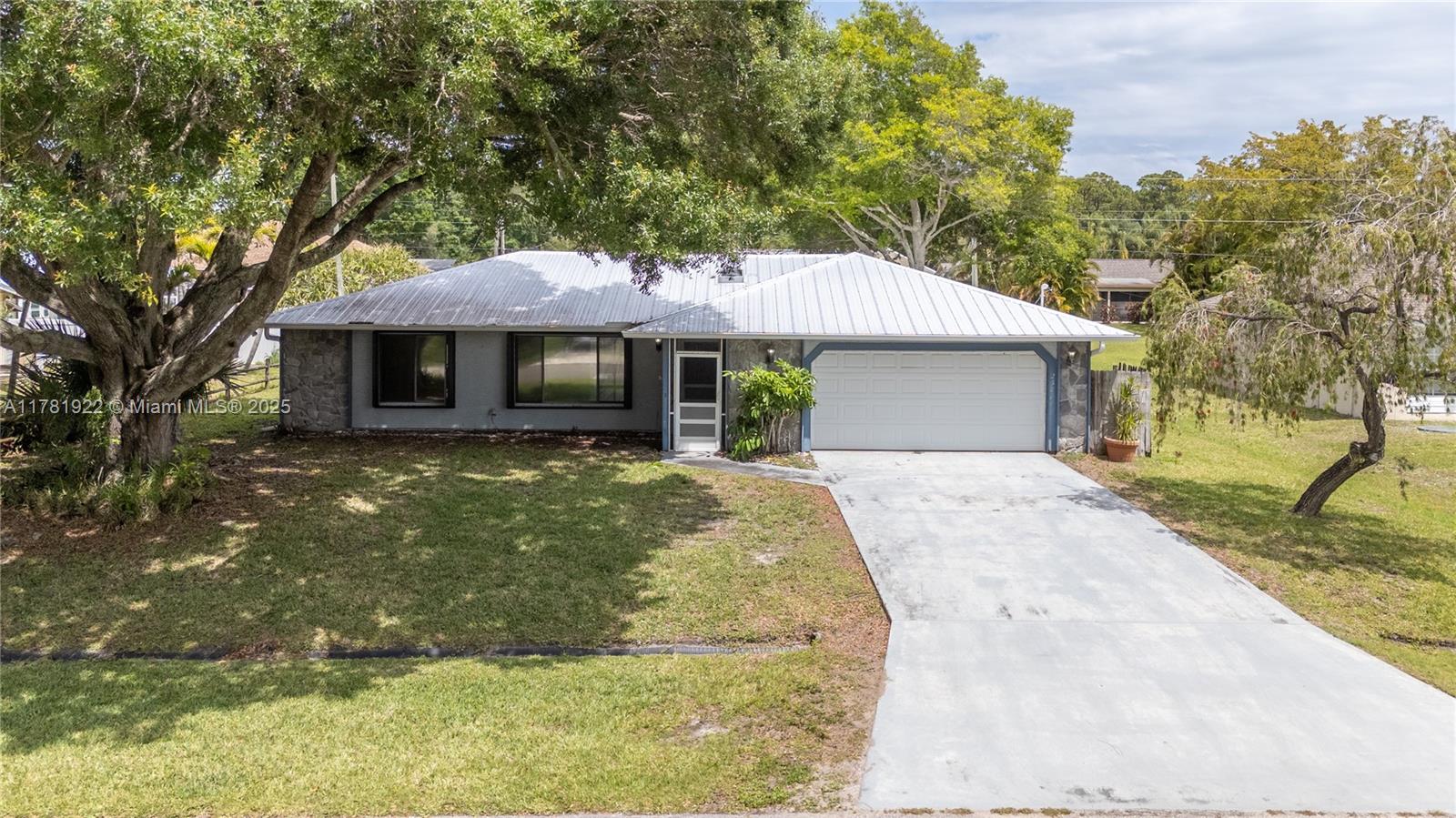 This 2 bedroom 2 bath home is located just East of US-1 in a very nice neighborhood on a quiet street! Split open floor plan and screened porch make it great for entertaining. Kitchen has brand new stainless steel appliances, large 2 car garage with huge driveway, newer metal roof and AC with accordion shutters that sits on a 10,000 SF lot. This house is close to major highways (Turnpike and I-95), restaurants, shopping and entertainment.