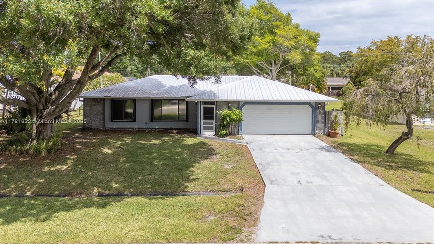 This 2 bedroom 2 bath home is located just East of US-1 in a very nice neighborhood on a quiet street! Split open floor plan and screened porch make it great for entertaining. Kitchen has brand new stainless steel appliances, large 2 car garage with huge driveway, newer metal roof and AC with accordion shutters that sits on a 10,000 SF lot. This house is close to major highways (Turnpike and I-95), restaurants, shopping and entertainment.