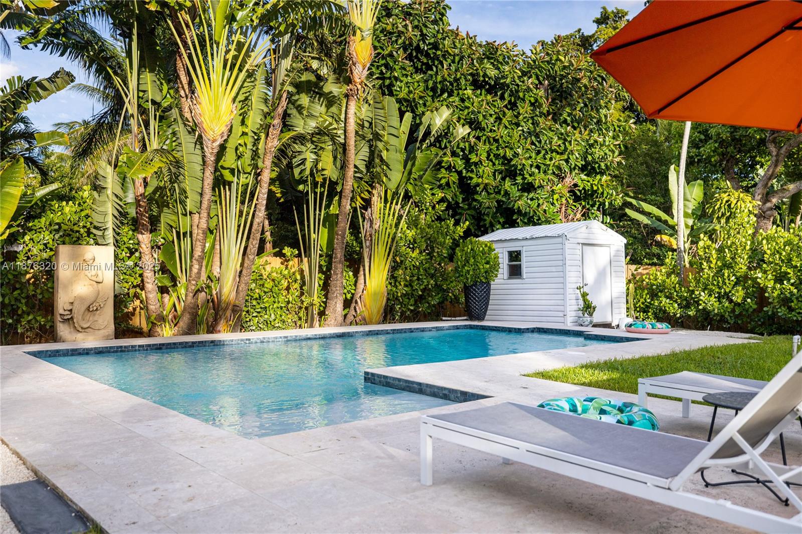 Tropical Dream Villa in Miami with Pool
Beautifully updated, turn-key Biscayne Park pool home located on a peaceful, tree-lined street. This spacious 3-bedroom, 3-bathroom home features a large family room and formal dining area, all overlooking a serene backyard oasis. The modern kitchen is equipped with stainless steel appliances, granite countertops, and a wine cooler—perfect for entertaining.
Relax in the private, fenced backyard with a sparkling pool, covered seating area, and lush landscaping. The large front yard offers ample parking. Enjoy close proximity to shops, restaurants, parks, and more—just 15 minutes from the Design District and Bal Harbour Shops.