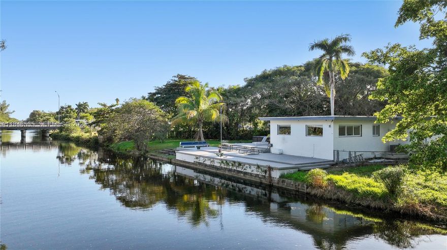 Exceptional waterfront opportunity in North Miami! This 2,800 SF home, located on the north lot of a generous 13,587 SF property, features 4 bedrooms and 3 bathrooms, offering an ideal blend of luxury and functionality. The property is in the process of being split into two lots; the sale includes the north lot only. Enjoy direct water access and a private deck, perfect for serene living or entertaining. Positioned next to a newly developed city park, this home offers added appeal and outdoor leisure space. Plumbing and electrical systems are completely new, ensuring modern reliability. Furniture purchase is optional, making it a seamless move-in or investment opportunity. Don't miss this rare find in a prime location!