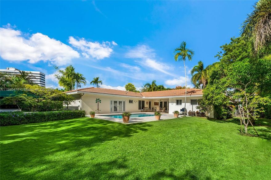 This very private ranch style home is located in the guard-gated enclave of Bay Point. No access unless you live there or granted access as a guest by property owner. The 4 BR/3BA home offers a well-proportioned open living, dining & kitchen layout and beautiful wood floors throughout, plus large windows that allow for serene natural light to stream inside the home. Features a 15,450 SF square foot lot with mature lush foliage and fruit trees, a large saltwater pool, spacious yard with open grass areas. Additional features include hurricane impact windows and doors, and a carport for 2 cars. The home is in a prime location, just minutes to the Design District, Wynwood, Miami Beach, downtown Miami, cultural & sports venues, fine dining, shopping & Miami International airport.